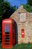 Old fashioned Telephone box + Post box beside barn. Norfolk, U
