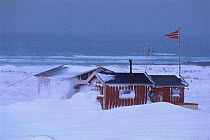 Modern house in winter with snow drift, near Vado, Varanger fjord, Arctic Norway