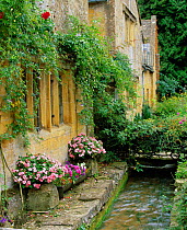 Village cottages with flowers and stream, Stanton, Cotswolds, Gloucestershire, UK 2003