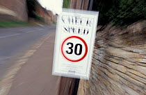 Thirty mile an hour 'Check speed' sign in village, Gloucestershire, UK 2003