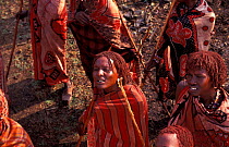 Masai warriors at ceremony wear colourful printed fabrics, Eunoto ceremony, Kenya.