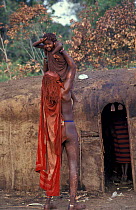Masai warrior holding boy, Eunoto ceremony, Mara, Kenya