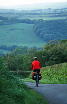 Cyclist on Celtic bicycle trail, Pembrokeshire, Wales.