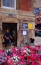 Cyclist in doorway of Bike Park building, Leicester, England