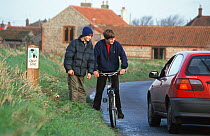 Cyclists talking to car driver on 'Quiet Lane Project' Norfolk, England