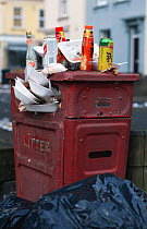 Rubbish overflowing from street bin, Bristol, England