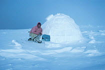 Cameraman Doug Allan in front of igloo. Taken during filming for Blue Planet. 1999