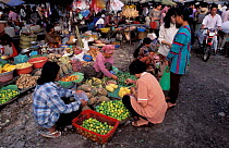 People buying fruit at local market, Phnom Penh Cambodia