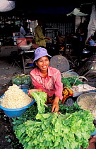 Local vor selling food at market, Phnom Penh, Cambodia
