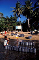 Water cannisters shipped from the mainland and delivered to the islands. Philippines