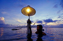 Seahorse fisherman with banka (outrigger boat) and lantern. Bohol Is, Philippines