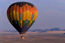 Hot air balloon over dried river in Namib desert, Sossusvlei NP, Namibia