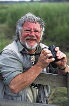 BBC Television presenter Bill Oddie birdwatching, Norfolk, UK, 2002