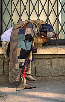 Homeless woman sleeping rough on the street, Antananarivo, Madagascar