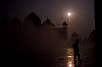 Tourist at dawn in mist, Taj Mahal, Agra, Uttar Pradesh, India