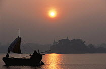 Silhouette of boat on River Ganges, Bihar, India David Attenborough on board