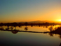 Sunset over River Severn in flood, Powick Hams, Worcestershire, England