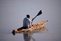 Traditional fisherman paddling in papyrus tankwa boat, Lake Tana, Ethiopia 2002