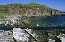 Rocky shore and clear water off Port Vasgo, Sutherland, Scotland, UK