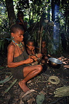 Mbuti pygmy woman making hunting net, Epulu Ituri, Democratic Republic of Congo, formerly Zaire