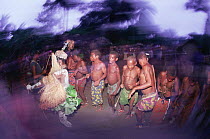 Dancing men at Kumbe ceremony circumcision ritual, Epulu Ituri, Democratic Republic of Congo, formerly Zaire
