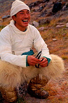 Inuit Narwhal hunter with Polar bear skin trousers, Qaanaaq, NW Greenland.