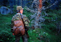 Hunter in woodland, Edsbyn, Sweden.