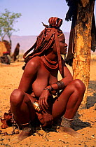 Himba woman squatting, Kaokoland, Namibia