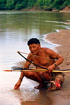 Yaminahua indian with hunted Peccary, Boca Mishagua River, Amazonia, Peru