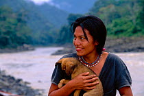 Machiguenga Indian + pet dog, Timpia Community, Lower Urubamba river, Peru Amazonia