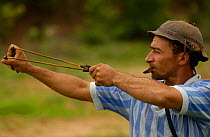 Bird hunting with whistle to call Doves + sling shot, Caatinga, Bahia state, Brazil
