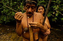 Huaorani prepare blow gun, rainforest tribe, Napo Province, Ecuador. Minihun & Tepa Boya
