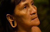 Huaorani indian woman with extended ear lobe, rainforest tribe, Napo Province, Ecuador.