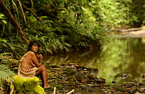 Huaorani indian beside river, rainforest tribe, Napo Province, Ecuador. Weca