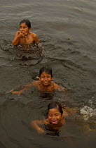 Quechua indian children swimming, Añangu Community, Yasuni NP, Napo River, Ecuador