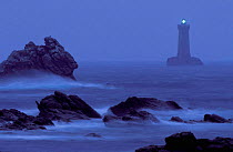 Four lighthouse at night in stormy weather, Brittany, France