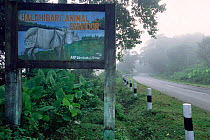 Rhinoceros warning sign on road in Animal Corridor, Kaziranga National Park, India