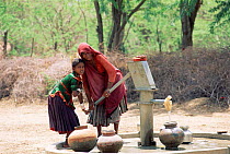 Villagers pumping water, Sirohi district, Rajasthan, India