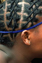 Hair braiding of Mantenga village woman, Swaziland, Southern Africa 2001