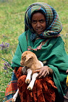 Shepherd with young goat, Bale mountains, Ethiopia