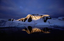 Ray of light on snow covered mountain, Lemaire Channel, Antarctica