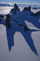 Nanutaks, mountains projecting above ice field, Dronning Maudland, Antarctica.