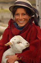 Quichua Indian child with lamb, Chimborazo, Andes, Ecuador. 2004