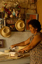 Eva Mero ironing Panama hats, Montecristi, Ecuador 2004