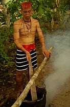 Colorado indian man preparing medical concoction, Santo Domingo de Los Colorados, Ecuador