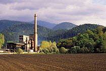 Communist era factory beside forest, Carpathian mountains, Romania,