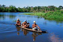 Hunters in canoe, Amazonia, Brazil