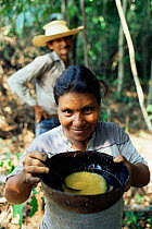 Drinking manioc flour with water, Mamiraua Ecol. Stn., Amazonas, Brazil