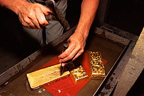 Cleaning gold bars at foundry, Fazenda Brasileiro, Bahia, Brazil Vale do Rio Doce company