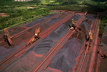 Heavy machinery moves iron ore deposits. Ponta da Madeira harbour, Maranhao, Brazil